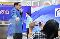Thailand prime minister sprays journalists with hand sanitiser as they try to grill him