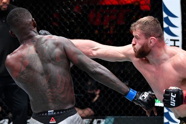 Jan Blachowicz (right) retained his light heavyweight title against middleweight champion Israel Adesanya