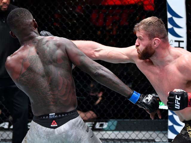 Jan Blachowicz (right) retained his light heavyweight title against middleweight champion Israel Adesanya