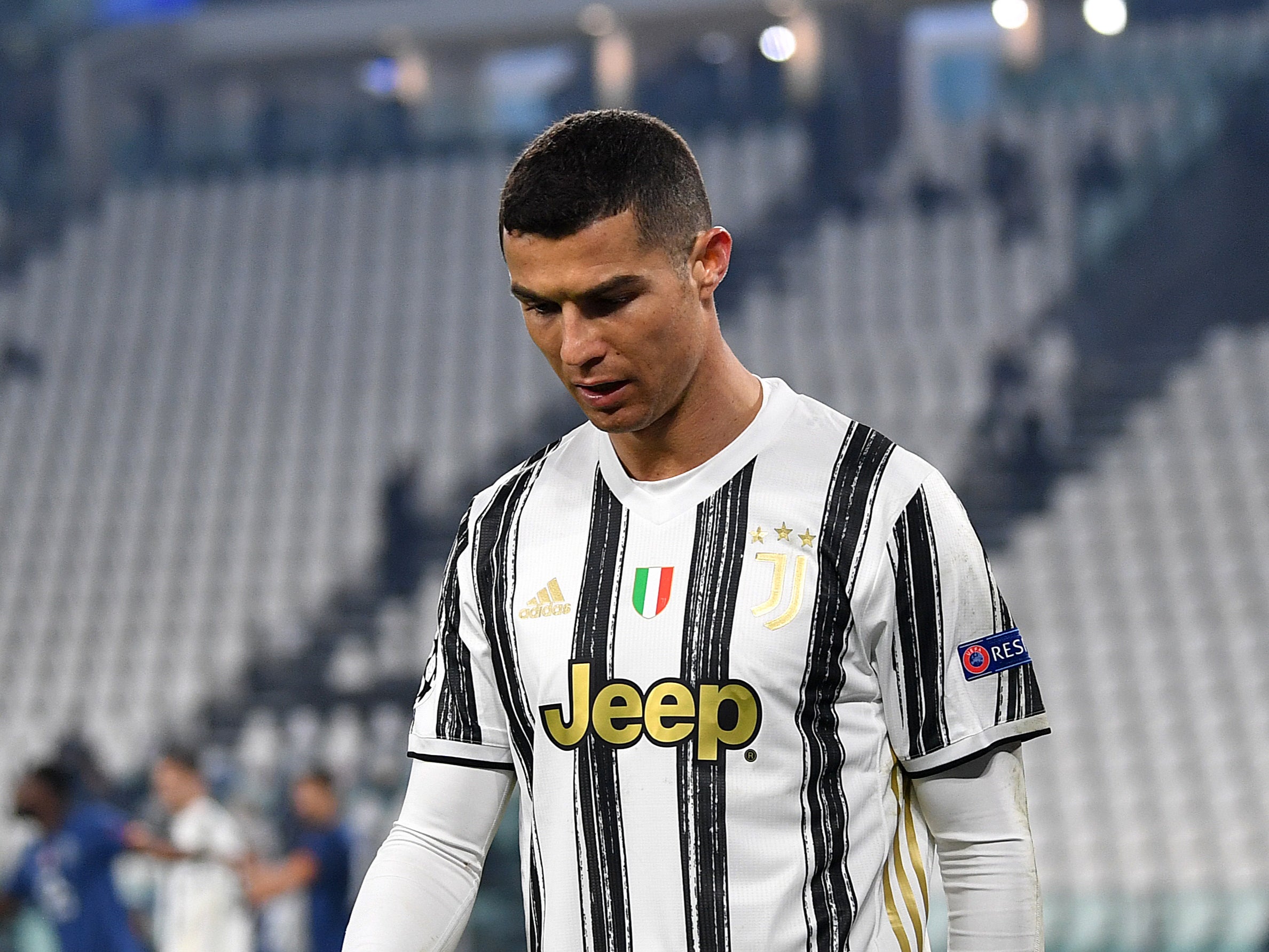 <p>Cristiano Ronaldo looks dejected after Juventus suffer elimination in the Champions League</p>