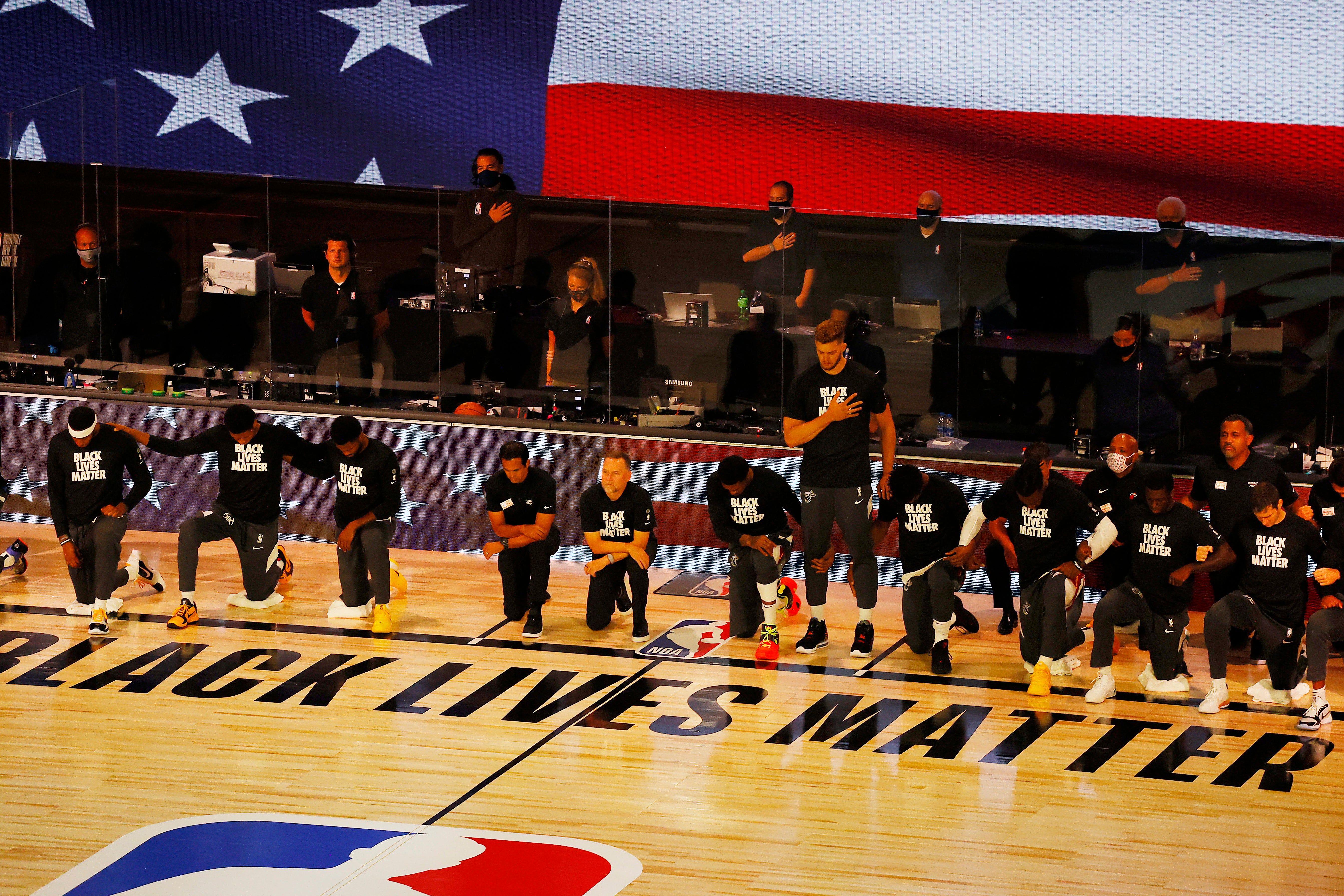 Meyers Leonard stands during the national anthem