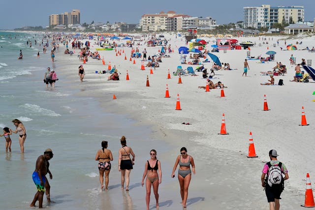 <p>Beachgoers take advantage of the weather as they spend time on Clearwater Beach Tuesday, 2 March, 2021, in Clearwater, Florida, a popular spring break destination, west of Tampa</p>