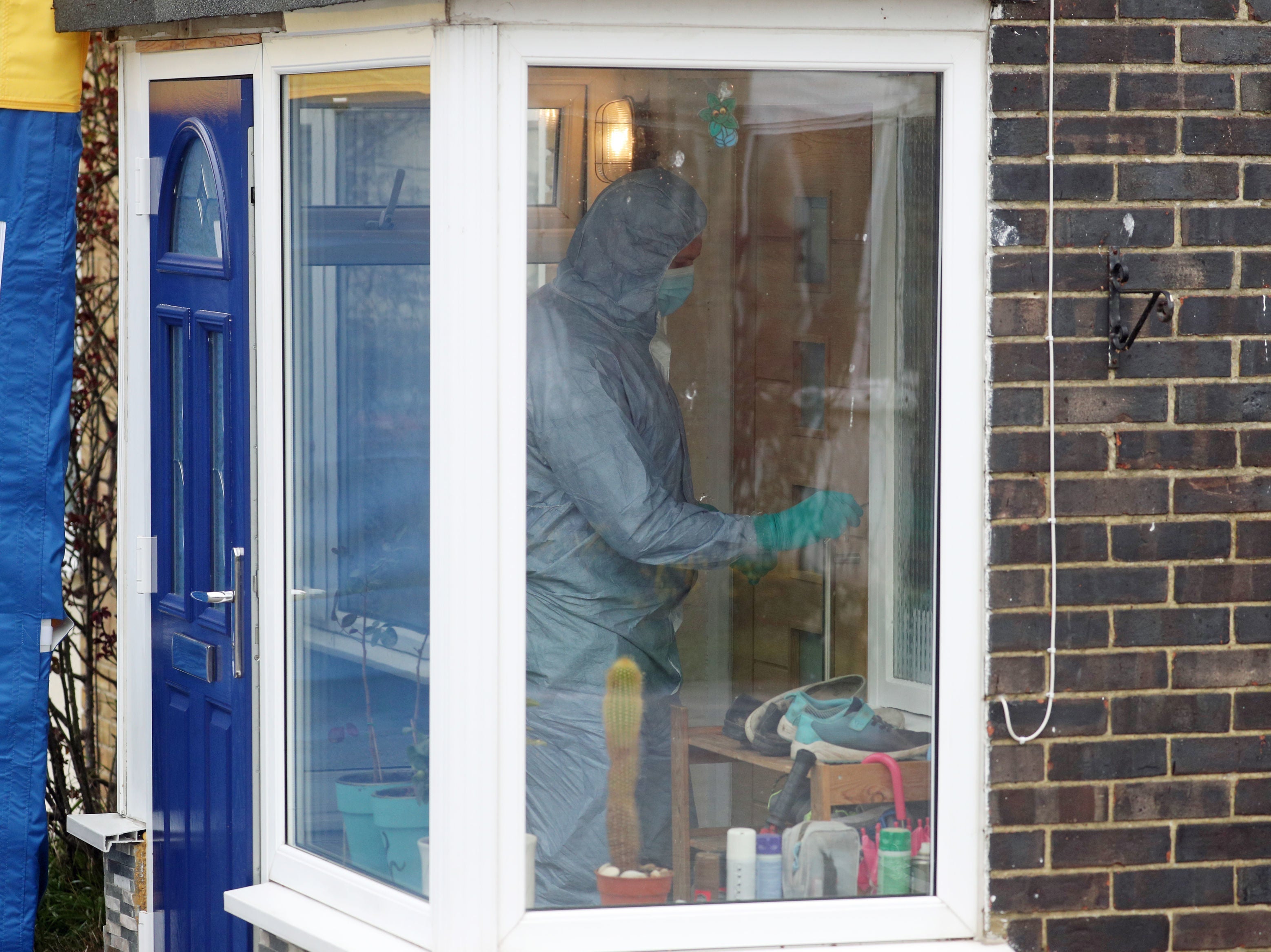 A forensic officer enters a house in Freemens Way in Deal, Kent, as detectives search for missing Sarah Everard