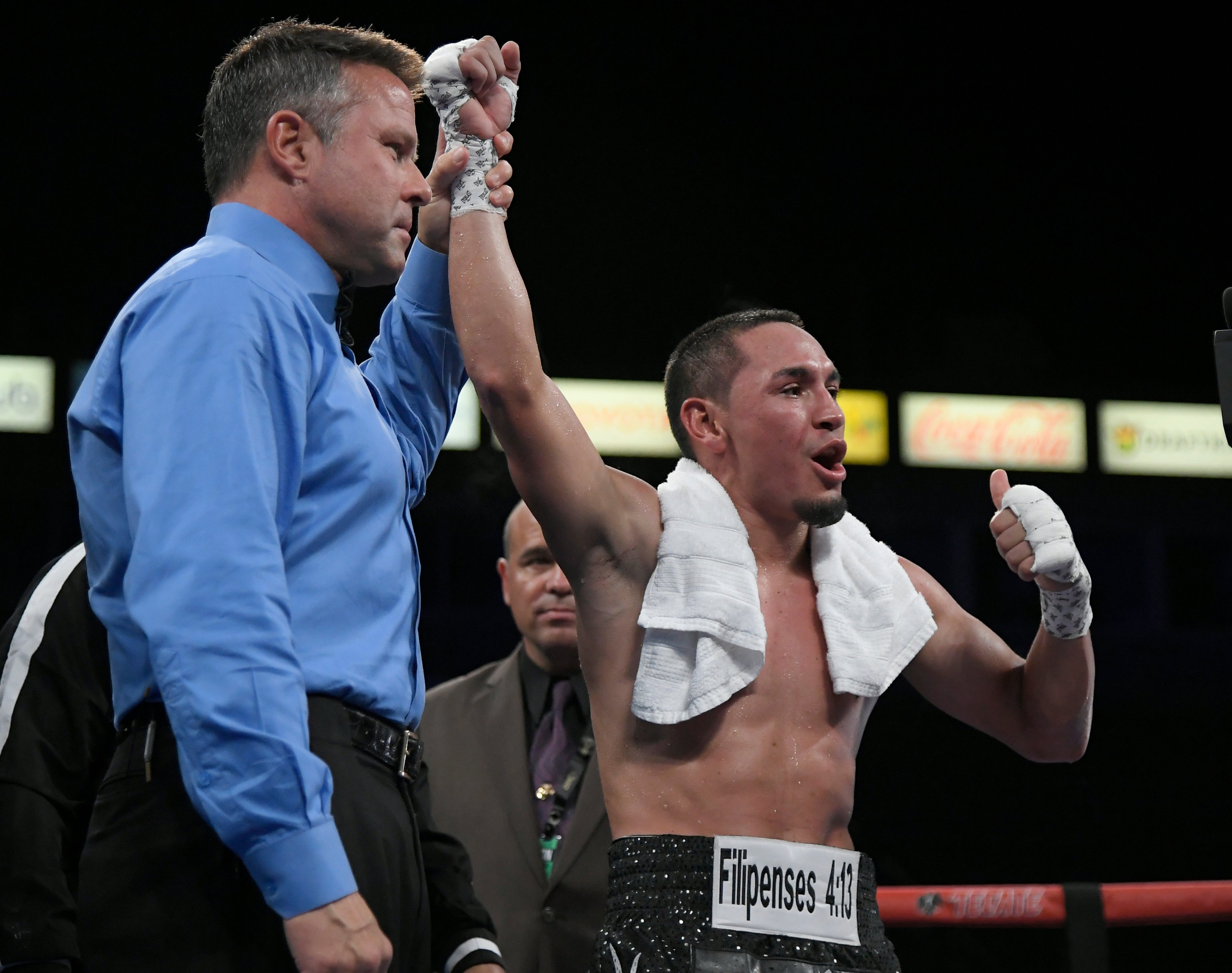 Juan Francisco Estrada has his hand raised in victory after defeating Victor Mendez