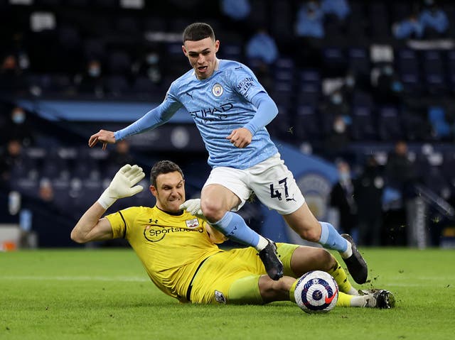 Manchester City forward Phil Foden and Southampton goalkeeper Alex McCarthy