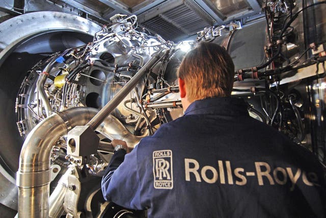 <p>Rolls Royce of a worker with the company's MT30 engine</p>