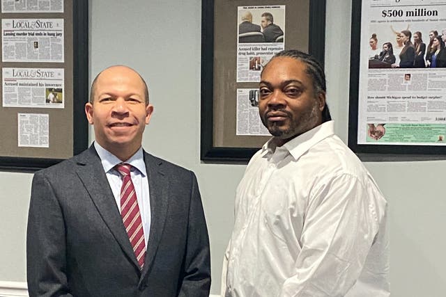 Herbert Alford, 47, (right), with attorney Jamie White, on the day they learned his wrongful conviction had been overturned in December 2020