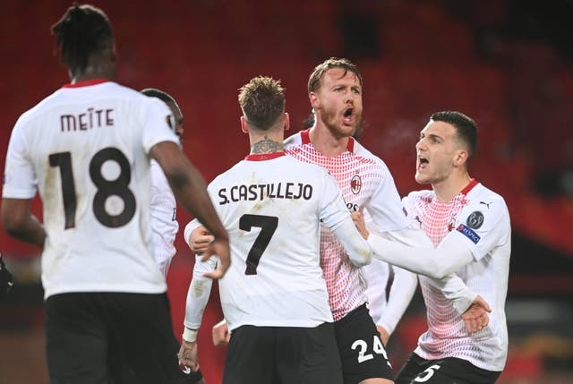 <p>Simon Kjaer celebrates with teammates Samu Castillejo and Diogo Dalot</p>