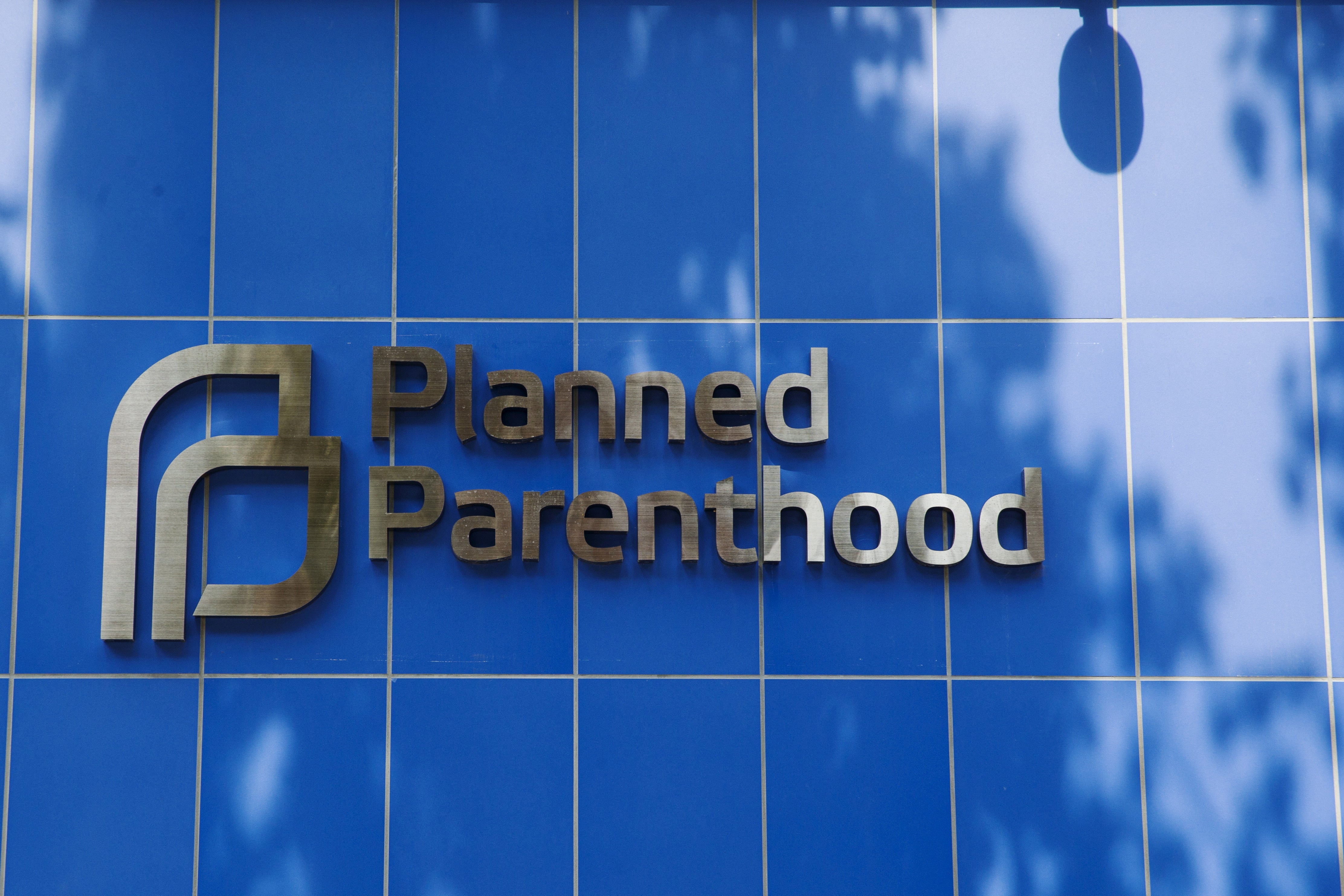 FILE PHOTO: A sign is pictured at the entrance to a Planned Parenthood building in New York August 31, 2015. Picture taken August 31, 2015. To match Insight USA-PLANNEDPARENTHOOD/ REUTERS/Lucas Jackson/File Photo