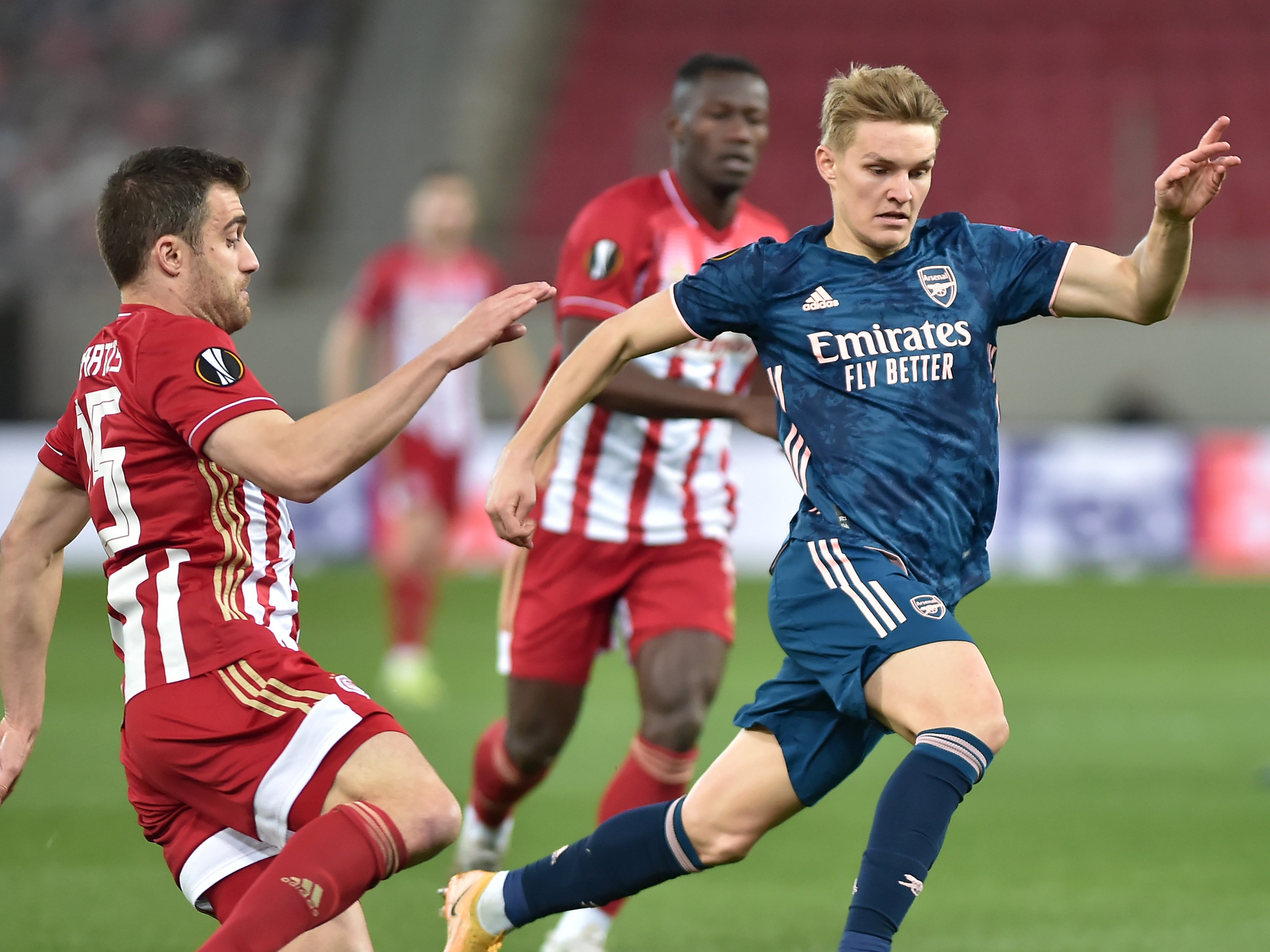 Martin Odegaard (right) opened the scoring in the last-16 first leg