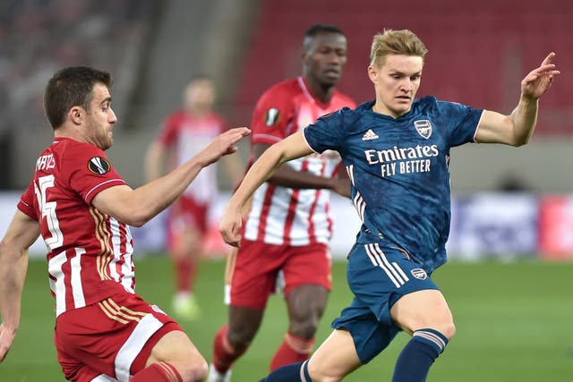 Martin Odegaard (right) opened the scoring in the last-16 first leg