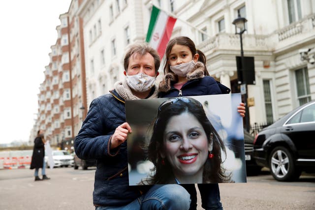 <p>Richard Ratcliffe, husband of British-Iranian aid worker Nazanin Zaghari-Ratcliffe, and their daughter Gabriella protest outside the Iranian Embassy in London</p>