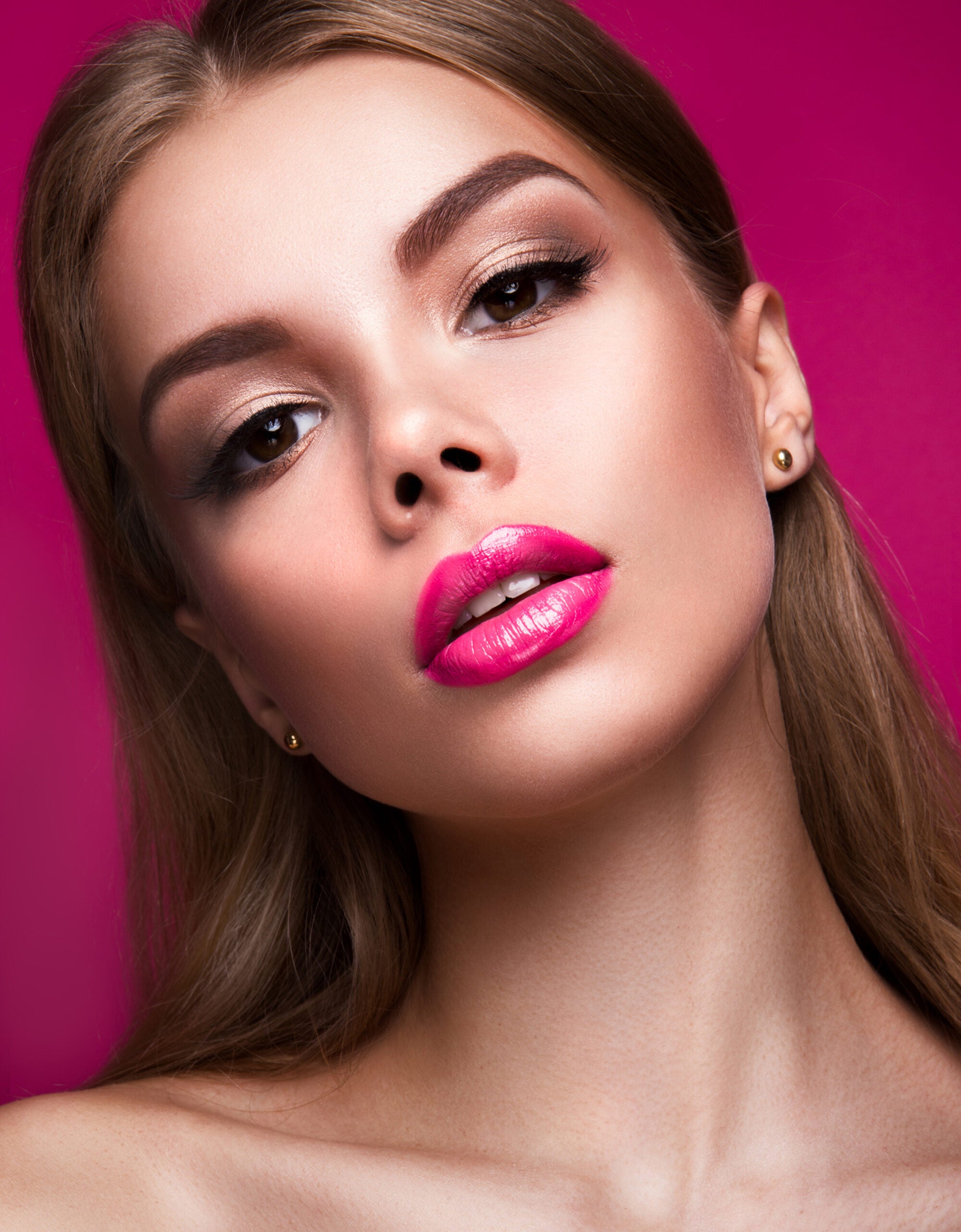 woman with bright pink lipstick