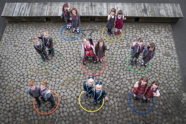Eight sets of twins are pictured ahead of their first day of school in Scotland. 