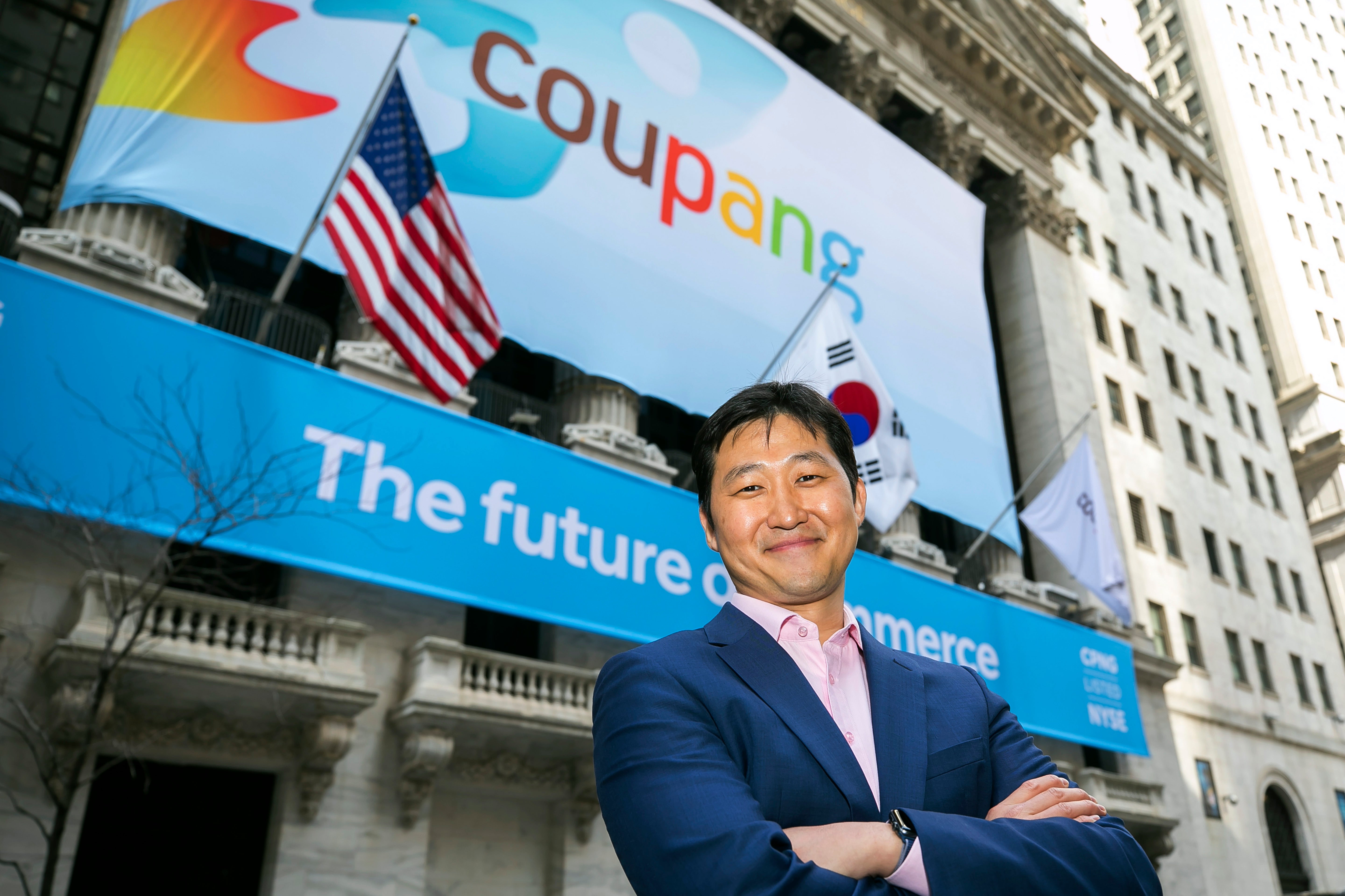 Coupang Founder and CEO Bom Kim poses in front of the New York Stock Exchange facade ahead of his company’s IPO