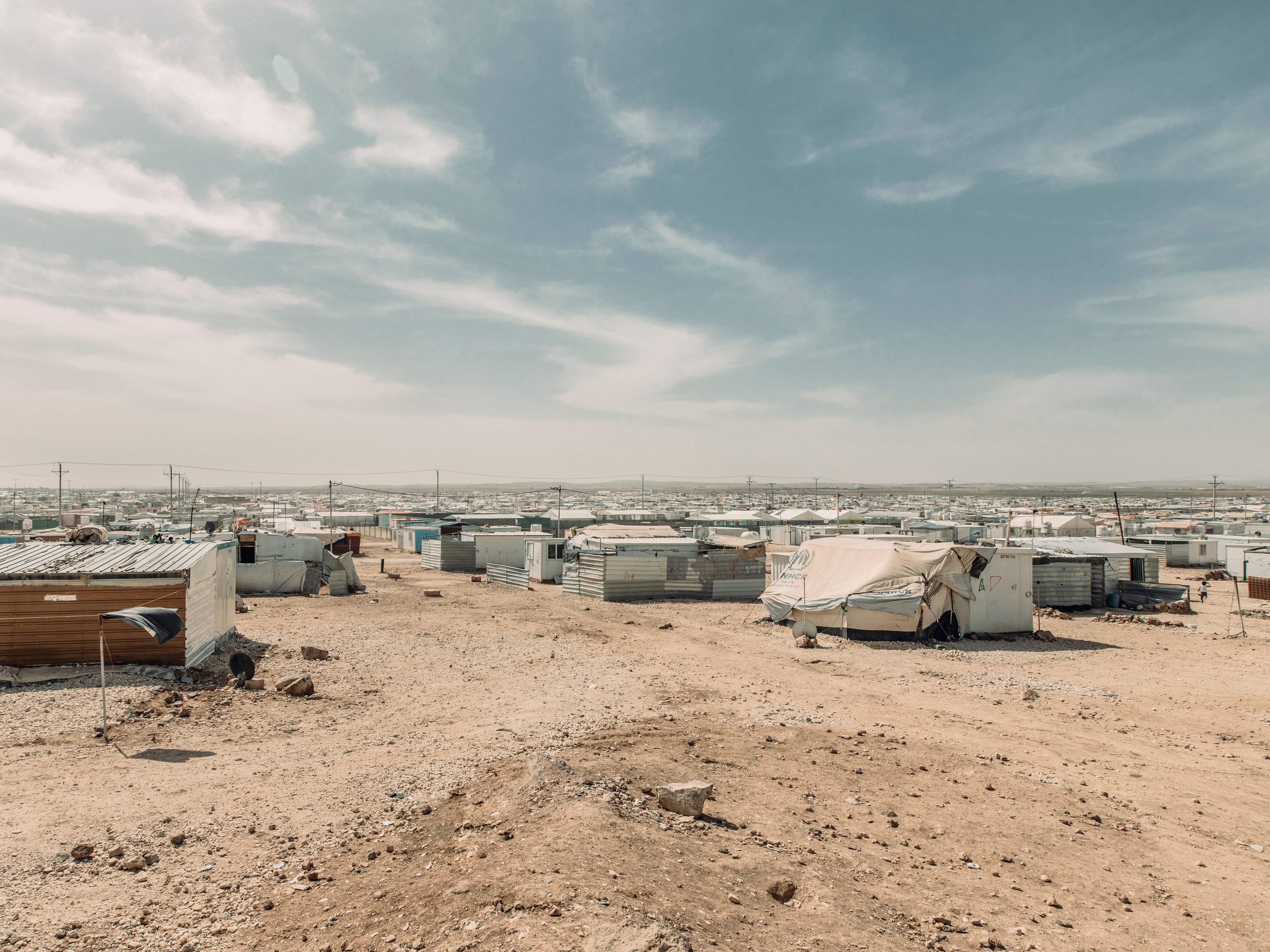 The view from the top, Zaatari refugee camp, Jordan, home to more than 76,000 Syrian refugees. At the start of the crisis, Zaatari was ranked the second largest refugee camp in the world. Jordan hosts 660,000 Syrian refugees and has in recent years created 100,000 work permits to enable Syrians to work legally and provide for their families. It is also the first country in the world to offer Covid 19 vaccinations to its refugees.