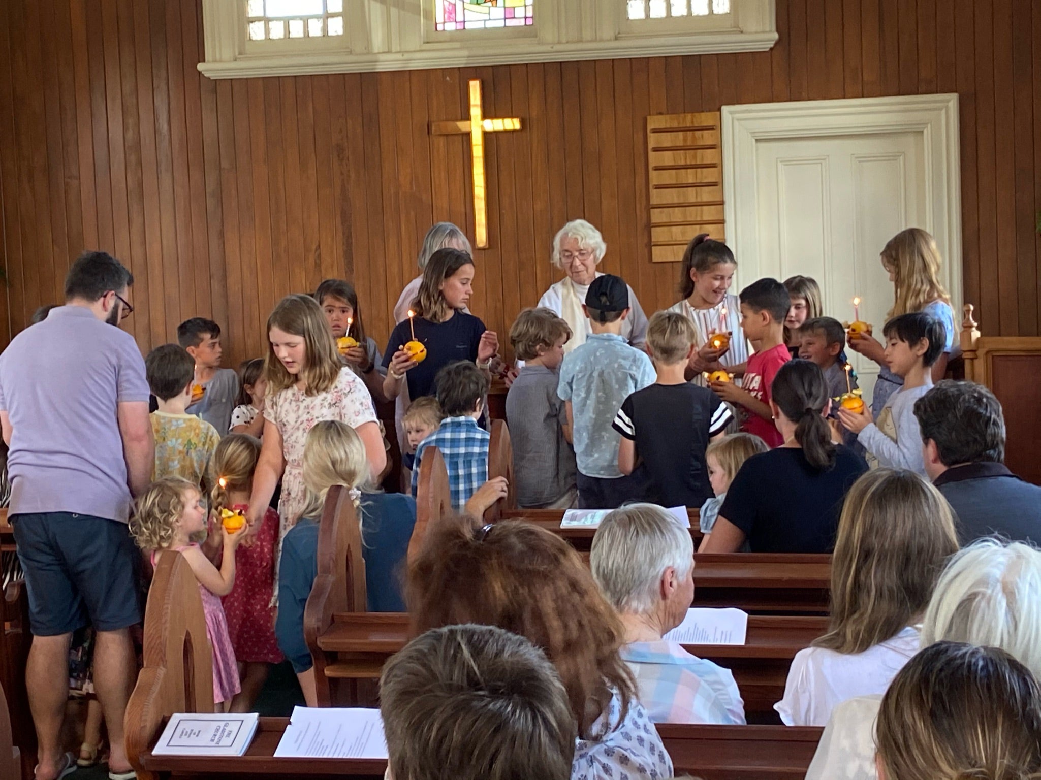 A crowded children’s service at a church in Gladstone, New Zealand, on Christmas Eve