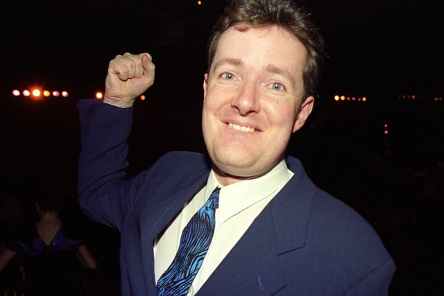 <p>One-man outrage: Piers Morgan takes aim while attending the 1994 Brit Awards</p>
