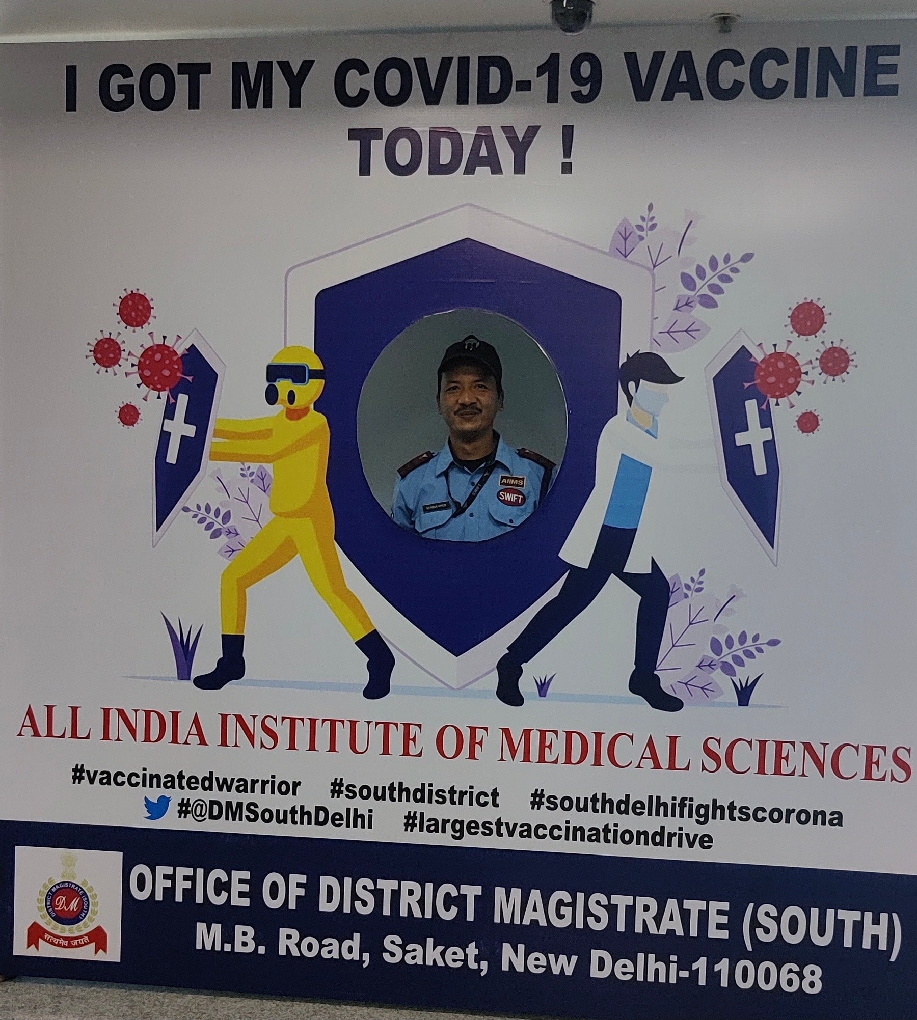 A security guard poses after getting Covid-19 vaccine shot in Delhi’s Aiims hospital