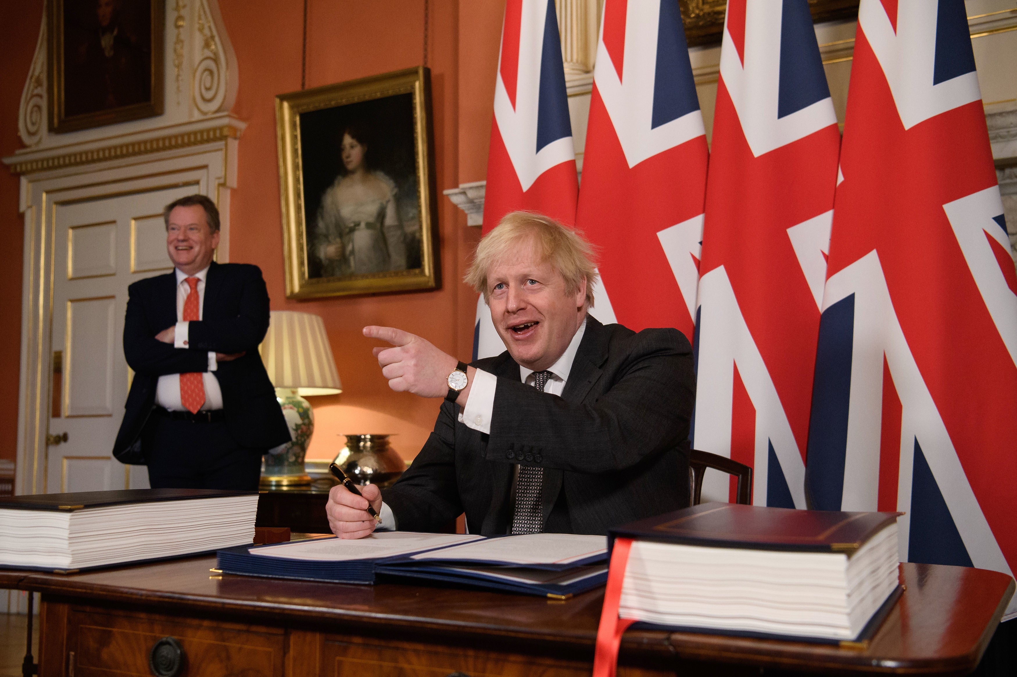 David Frost, before his elevation to the cabinet, watches Boris Johnson sign the EU trade deal
