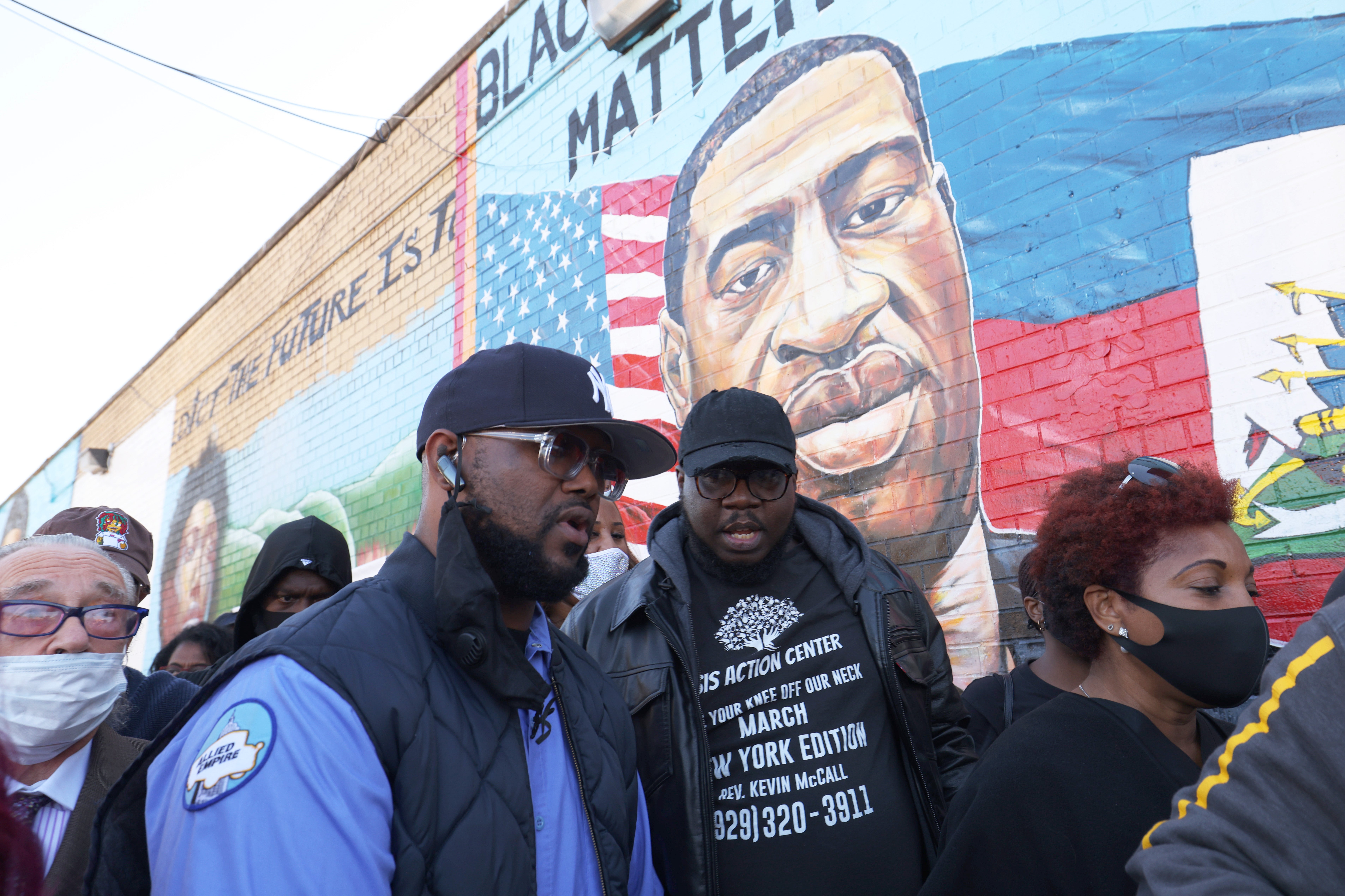 Terrence Floyd (left) marches during a vigil in celebration of his brother George’s 47th birthday