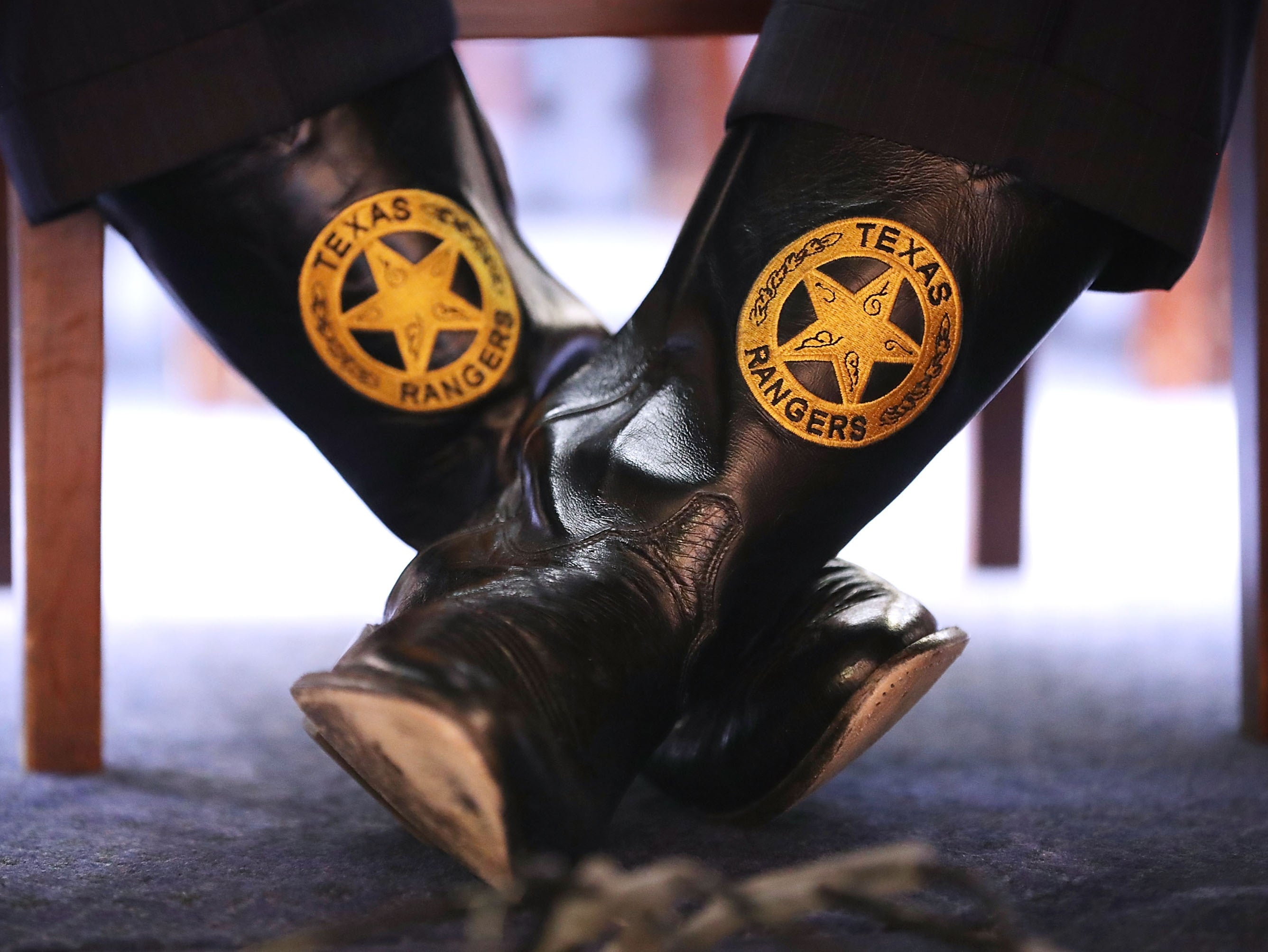 Texas Department of Public Safety Director Steven McCraw wears boots with the Texas Rangers seal as he testifies before Congress on April 12, 2018.