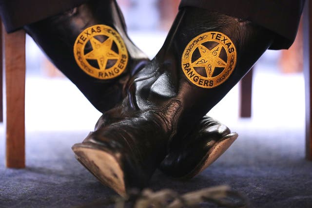 Texas Department of Public Safety Director Steven McCraw wears boots with the Texas Rangers seal as he testifies before Congress on April 12, 2018. 