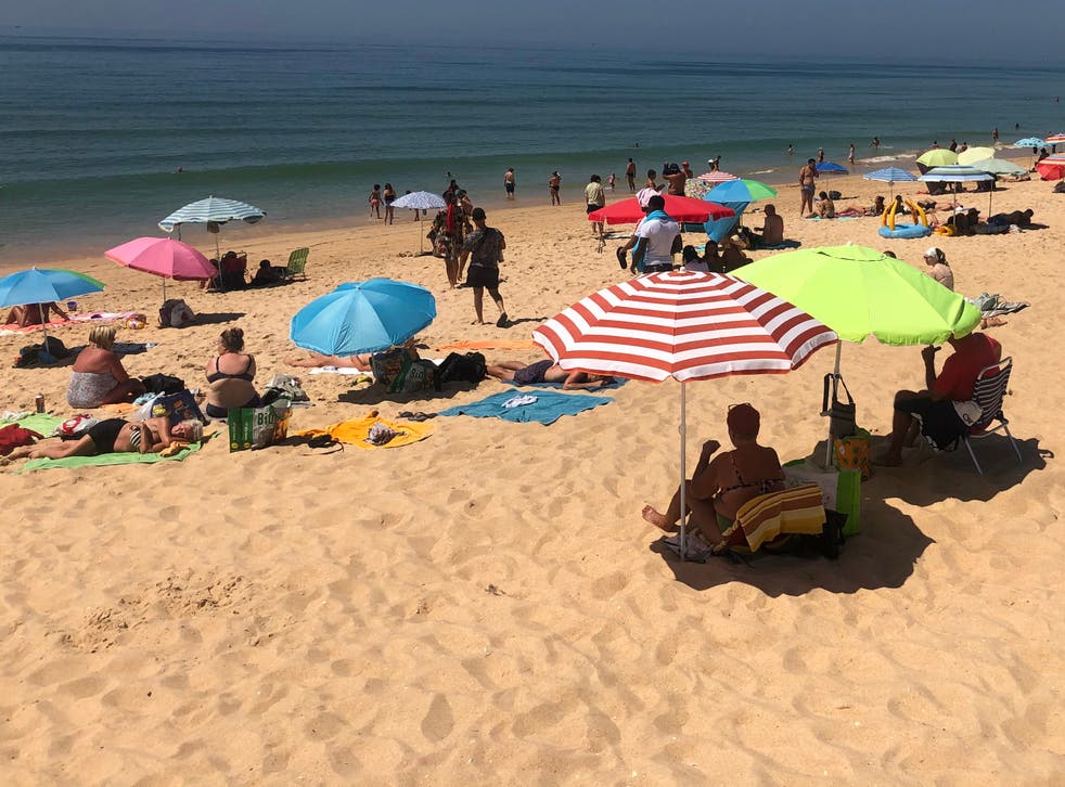 Sun blessed: the beach adjacent to Faro airport on the Portuguese Algarve coast