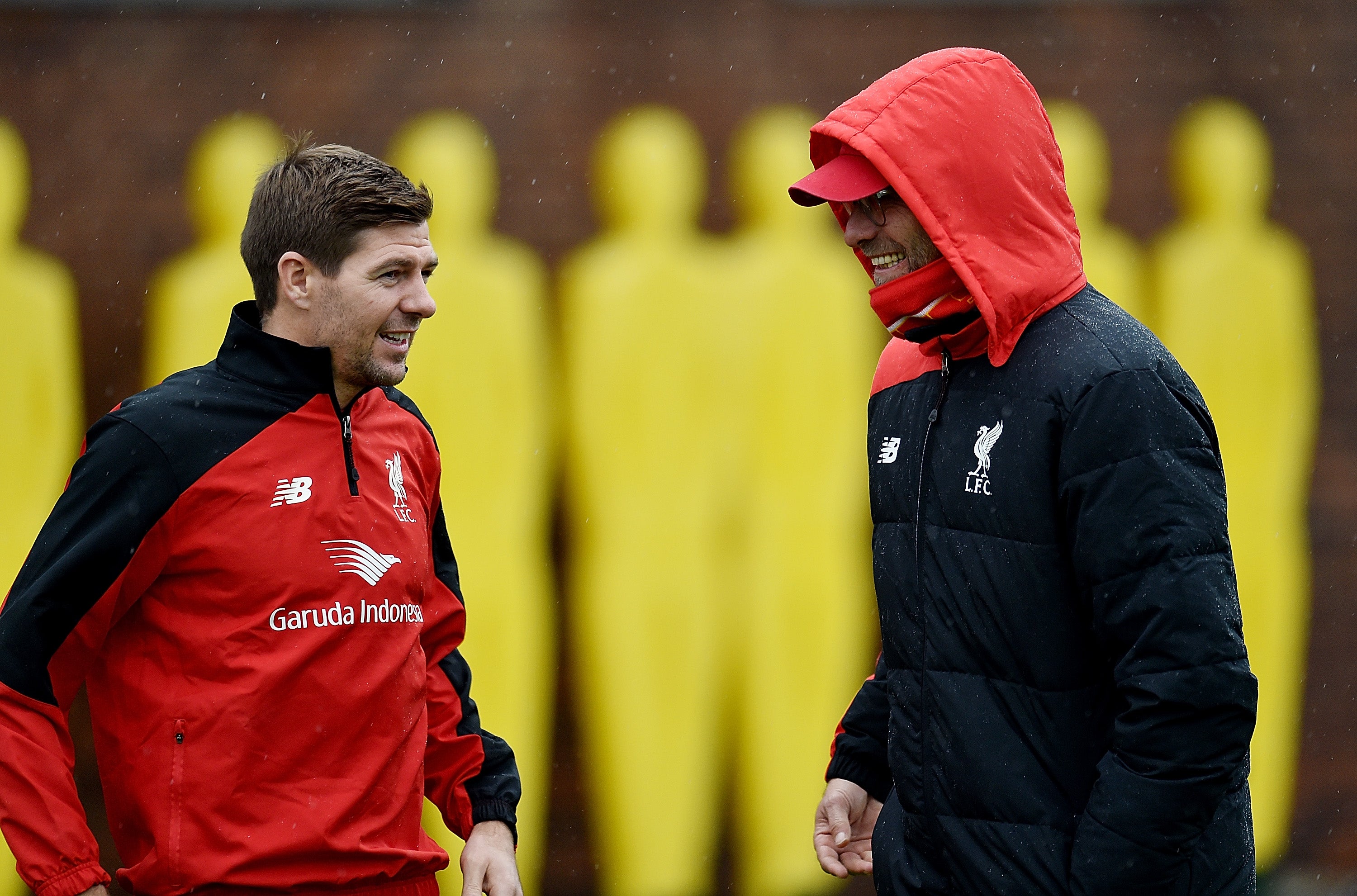 Steven Gerrard shares a conversation during the early stages of Jurgen Klopp’s reign at Anfield