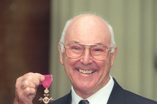 <p>Murray Walker with his OBE in 1996</p>