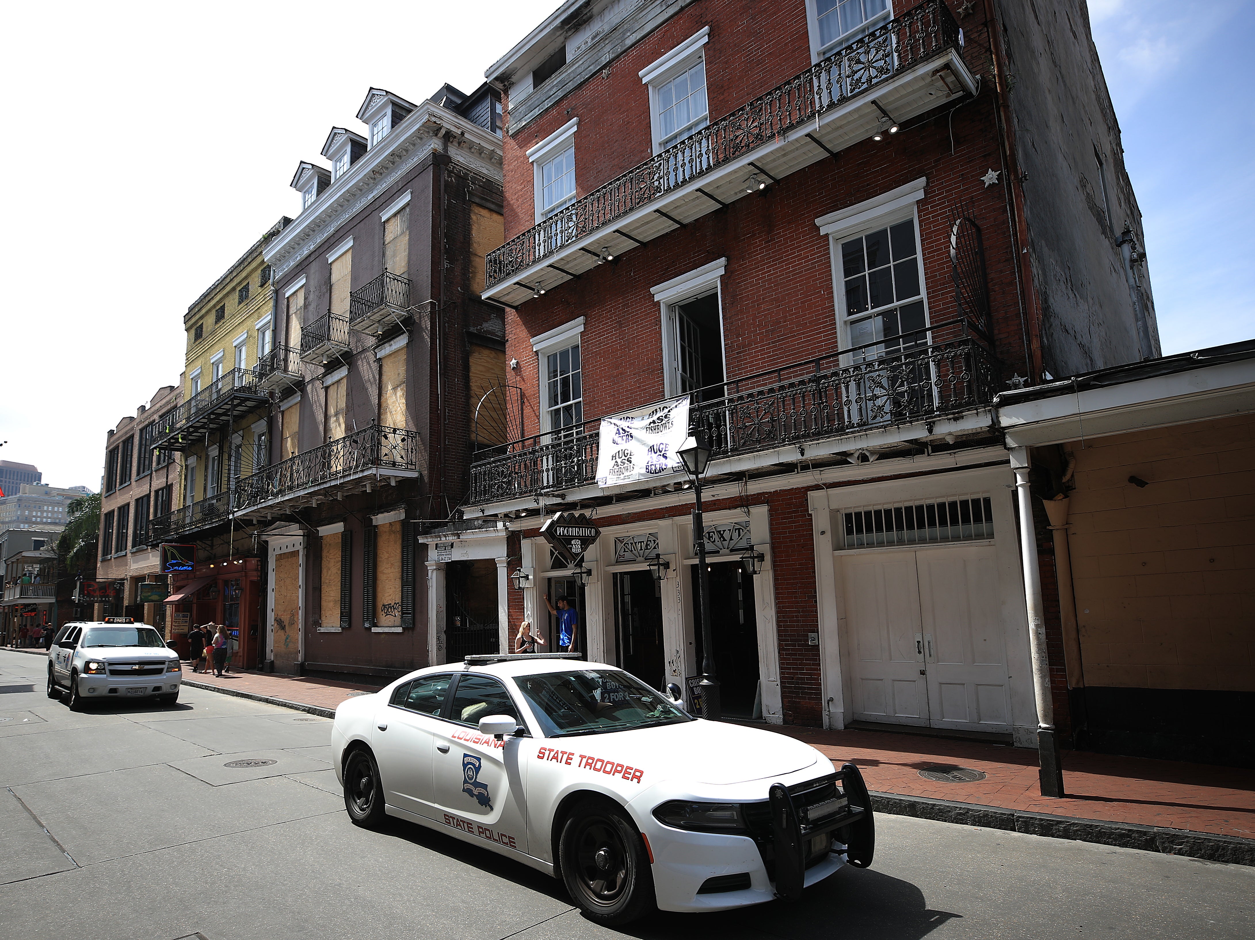 A State Trooper vehicle drives down Bourbon Street in the French Quarter on March 15, 2020 in New Orleans, Louisiana.