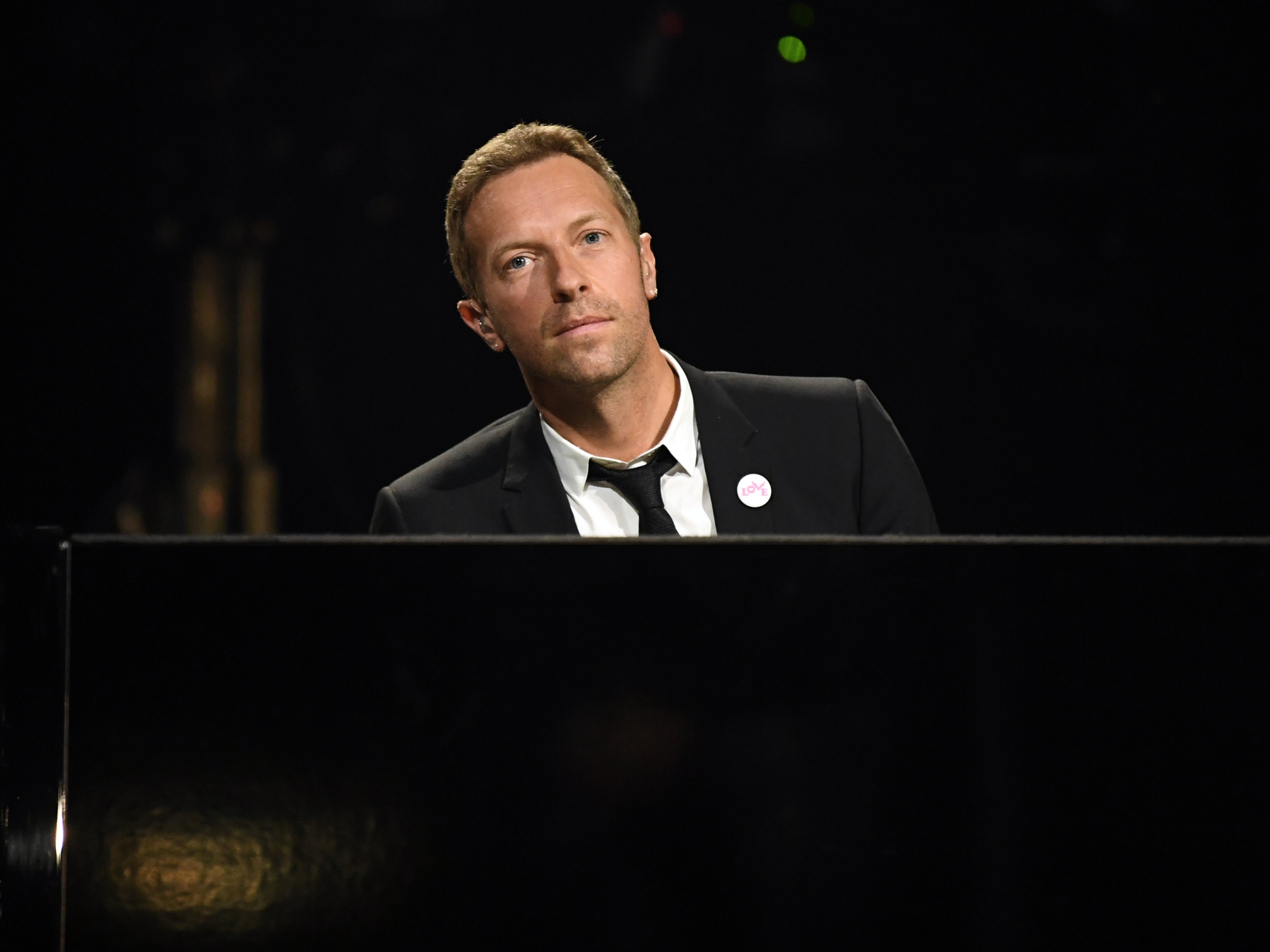 Chris Martin performs during the ‘in memoriam’ tribute at the Grammys