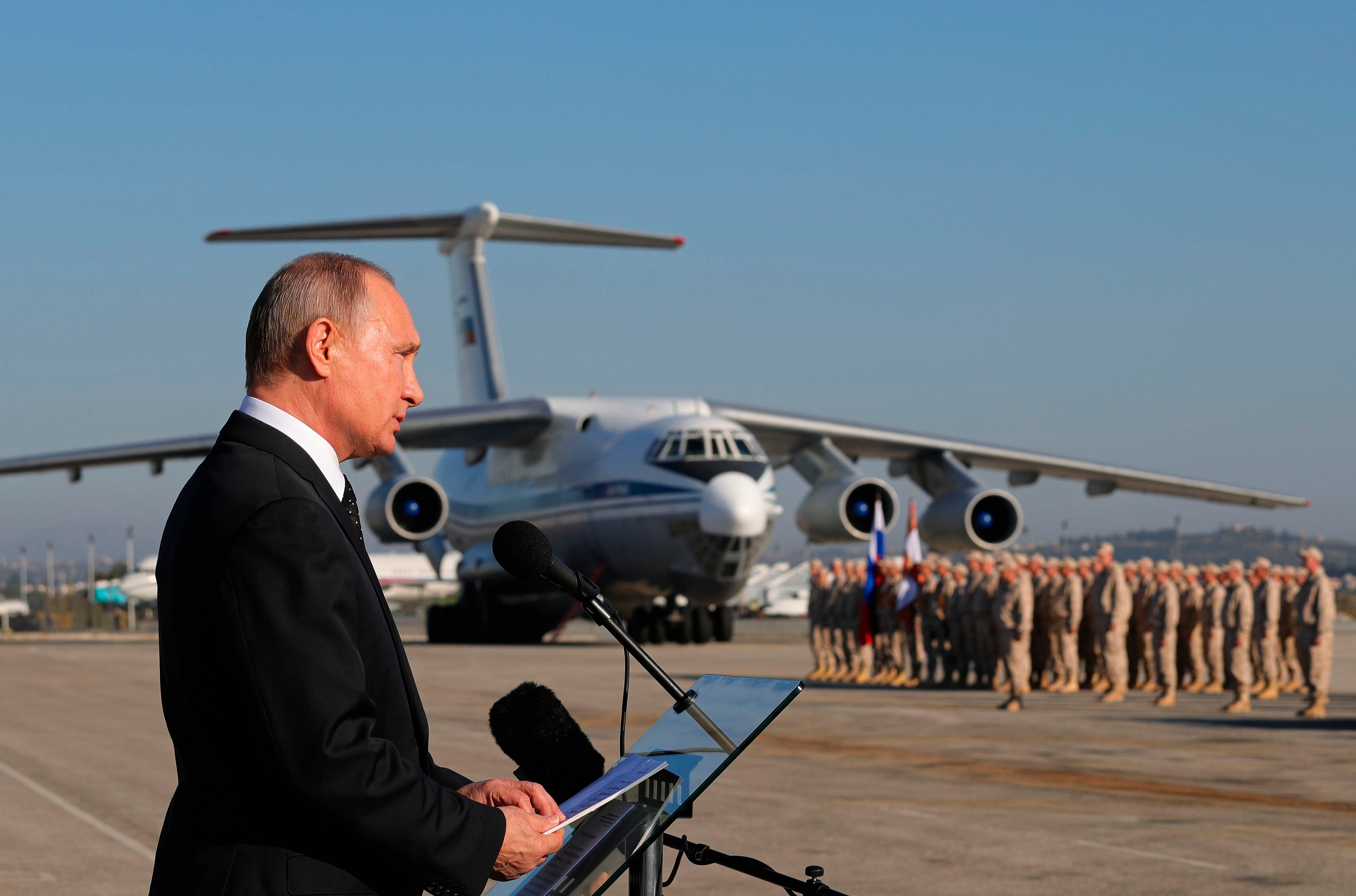 Russian President Vladimir Putin addresses the troops at the Hemeimeem air base in Syria in December 2017