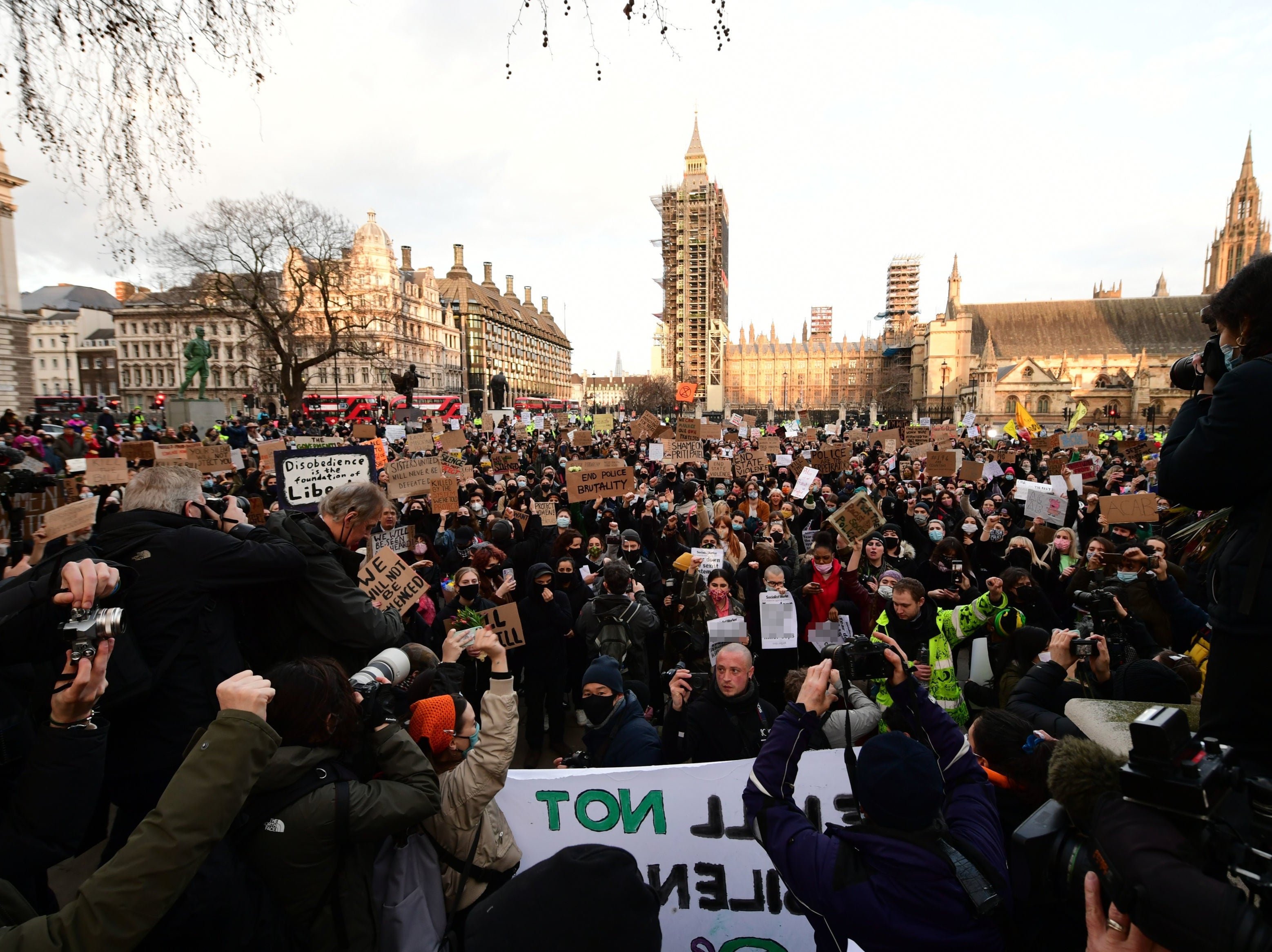 <p>Demonstrators during a protest in Parliament Square, central London, in memory of Sarah Everard who went missing while walking home in south London</p>