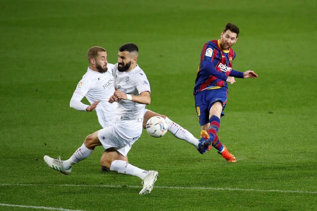 Lionel Messi fires a goal against Huesca