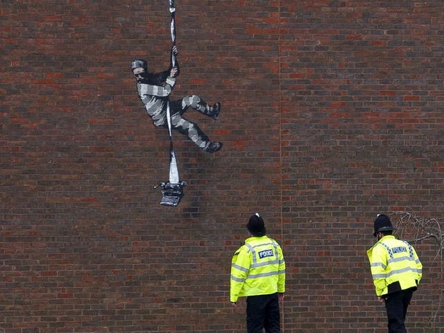 <p>File Image: Mural of artist Banksy on a wall at HM Reading Prison</p>