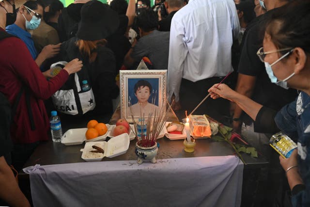 <p>File image: A portrait of Khant Nyar Hein is surrounded by mourners at his funeral in Yangon on 16 March after the first year medical student was shot dead during a crackdown by security forces</p>