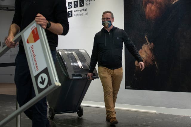 <p>A ballot box is brought to a polling station inside the Van Gogh museum in Amsterdam</p>