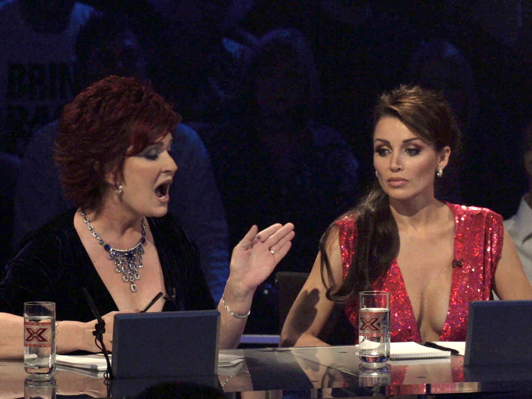 Nastiness deflected with a shrug and a giggle: Sharon Osbourne and Dannii Minogue in a 2007 episode of The X Factor