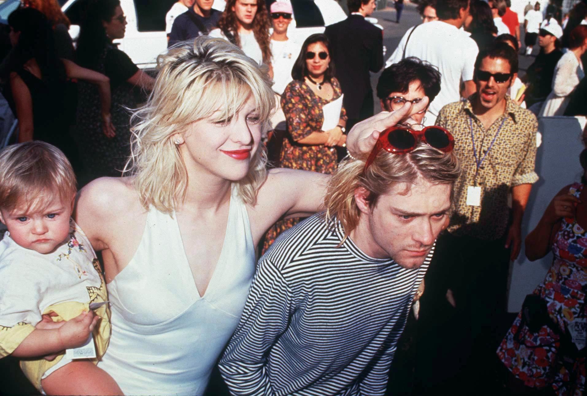 Courtney Love and Kurt Cobain with their daughter Frances Vean at the MTV Awards in LA, 1993