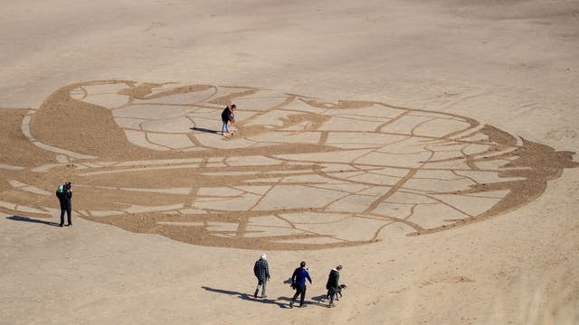 A giant 60-metre wide sand portrait of 12-year-old Ansha from Ethiopia created by WaterAid on Whitby Beach in Yorkshire. The image of the young girl, who spends hours each day collecting dirty water from a river, was created to illustrate how climate change threatens water access for world's poorest