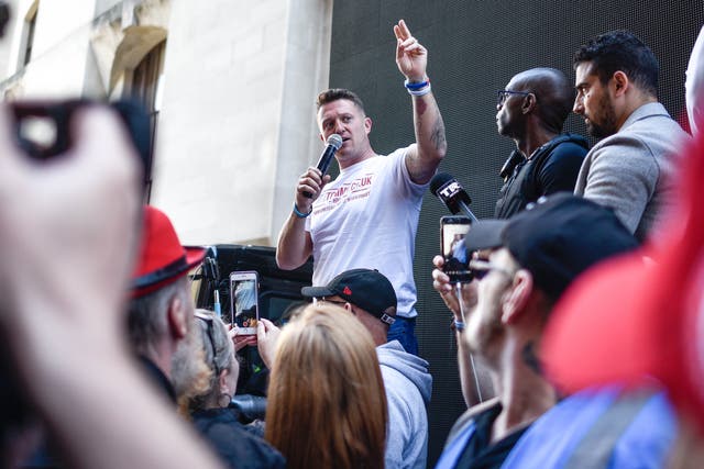 <p>British far-right activist Tommy Robinson speaks to his supporters outside the Old Bailey on 14 May 2019 in London</p>