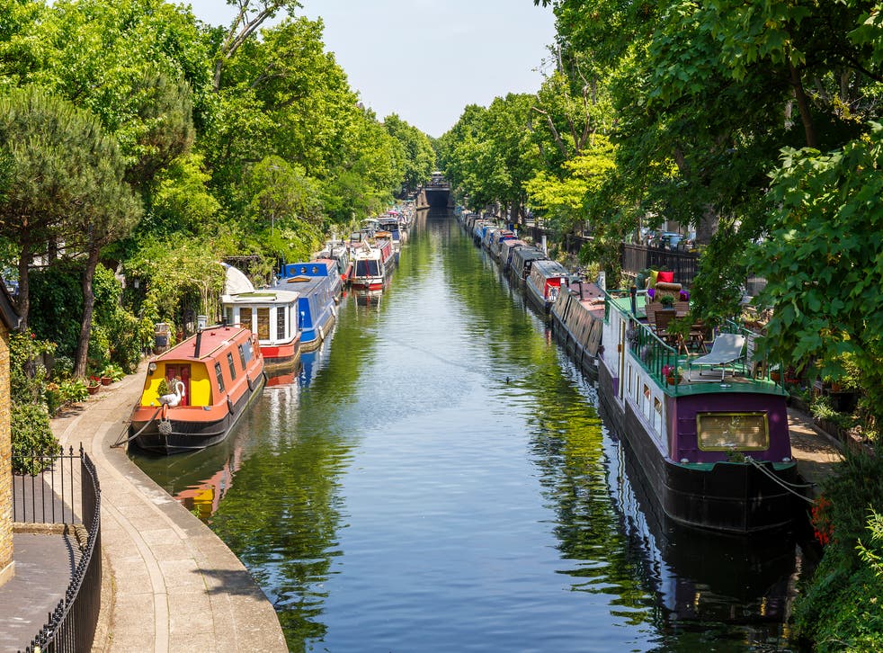 <p>Narrow boats moored at Regent’s Canal in Little Venice, London</p>