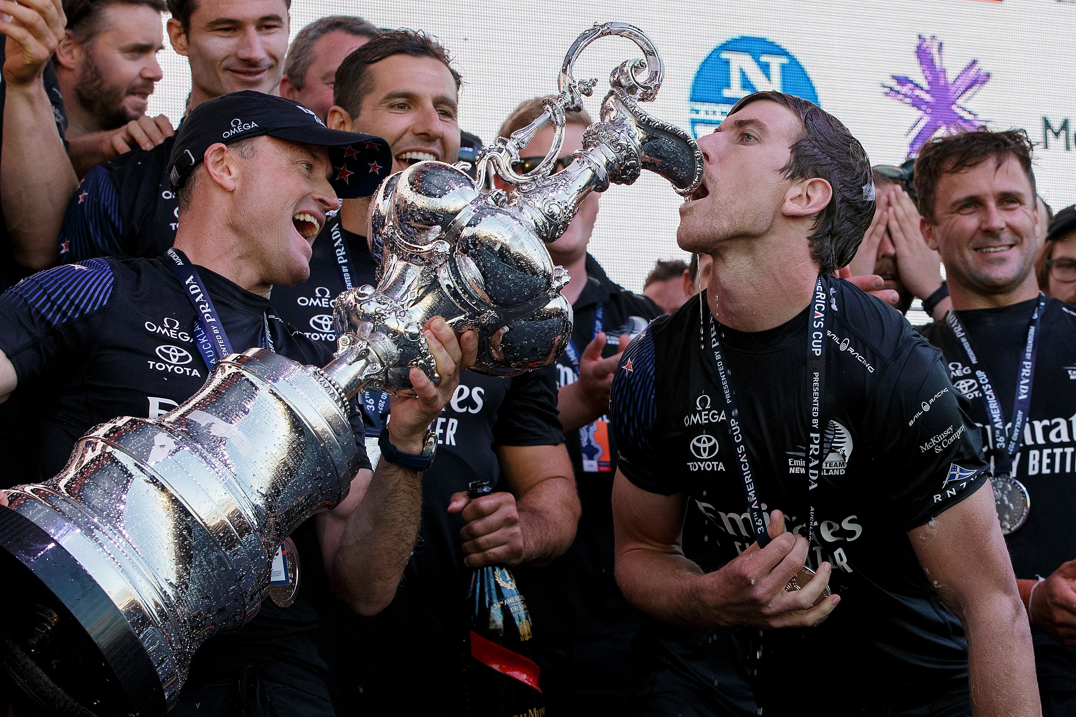 Glenn Ashby and Peter Burling of Team New Zealand celebrate