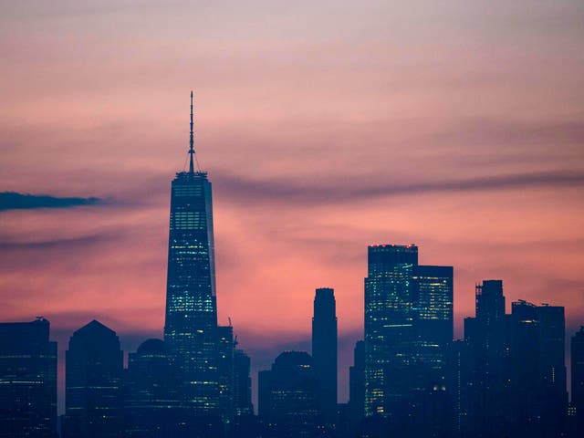 <p>The skyline of Lower Manhattan is pictured before sunrise on 9 July, 2020 in New York City</p>