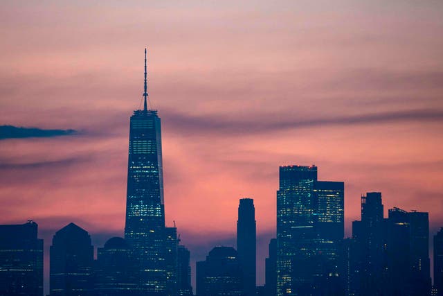 <p>The skyline of Lower Manhattan is pictured before sunrise on 9 July, 2020 in New York City</p>