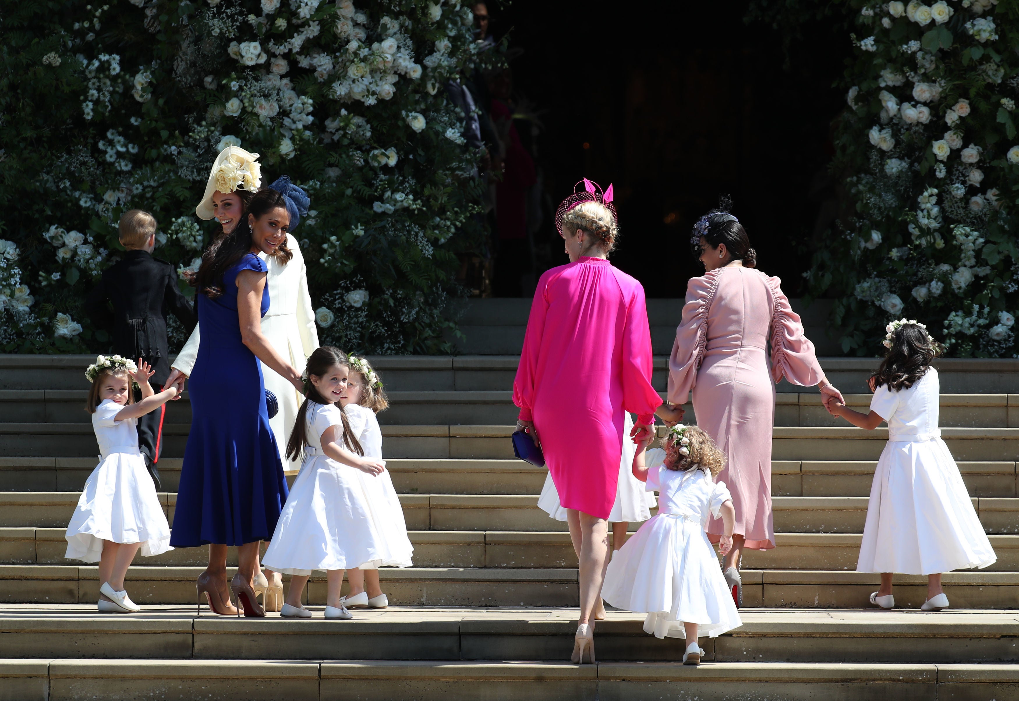 Jessica Mulroney, pictured left in blue, attending Meghan Markle’s wedding in Windsor in 2018, where three of her children were in the wedding party