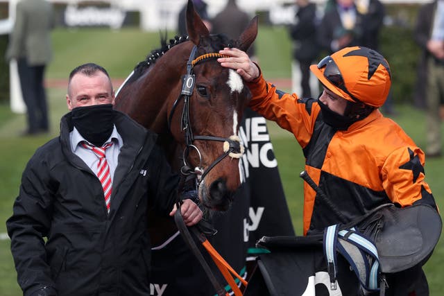 Aidan Coleman celebrates after winning the Champion Chase on Put The Kettle On
