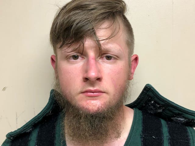 Robert Aaron Long, 21, of Woodstock in Cherokee County poses in a jail booking photograph after he was taken into custody by the Crisp County Sheriff’s Office in Cordele, Georgia, US 16 March, 2021