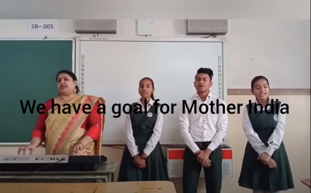 Screengrab from a video showing students singing “You Can Achieve” 